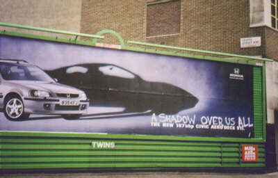 Poster image: car with Noir shadow. Addition: 'A shadow over us all'