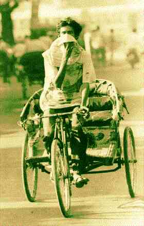 [Tricycle rickshaw in the smog]